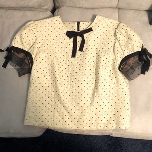 Cream colored short sleeve top